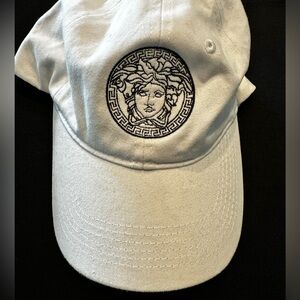 White hat with embroidered Versace logo